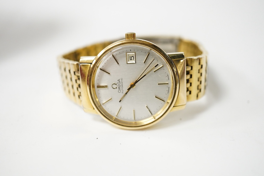 A gentleman's steel and gold plated Omega automatic wrist watch, with baton numerals and date aperture, on a steel and gold plated Omega bracelet, case diameter 35mm, box, no papers. Condition - fair